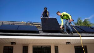 men on top of a roof